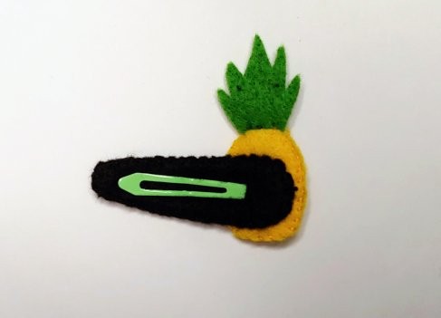 Handmade felt Pineapple Hair Clip with bright yellow and green felt, brown stitched details, and a secure snap clip - reverse side. A playful, tropical accessory.