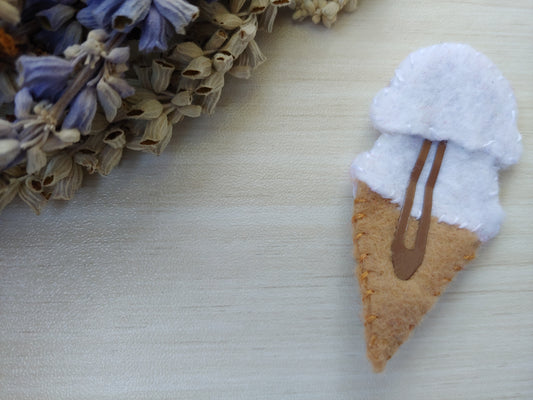 Handcrafted Patriotic Ice Cream Cone Felt Hair Clip featuring a tan cone, white scoops, and red & blue sprinkles on a secure snap clip - reverse side shown. A fun 4th of July accessory.