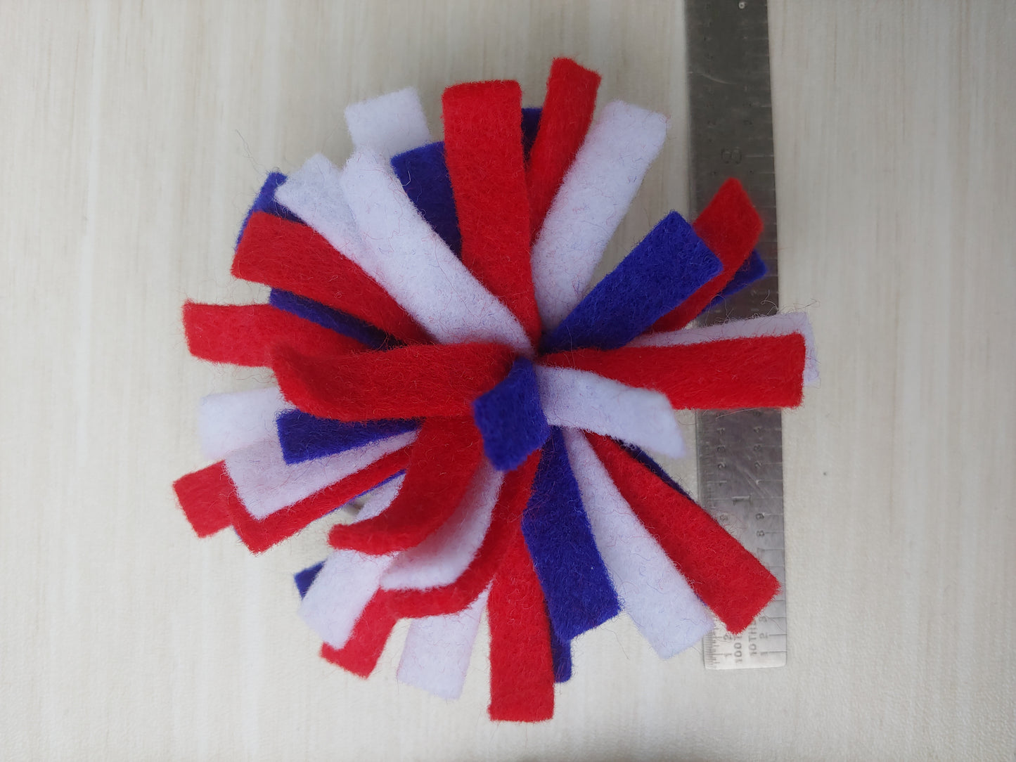 Handcrafted Patriotic Firework Felt Hair Tie featuring red, white & blue felt on an elastic band. Perfect for 4th of July & USA pride.