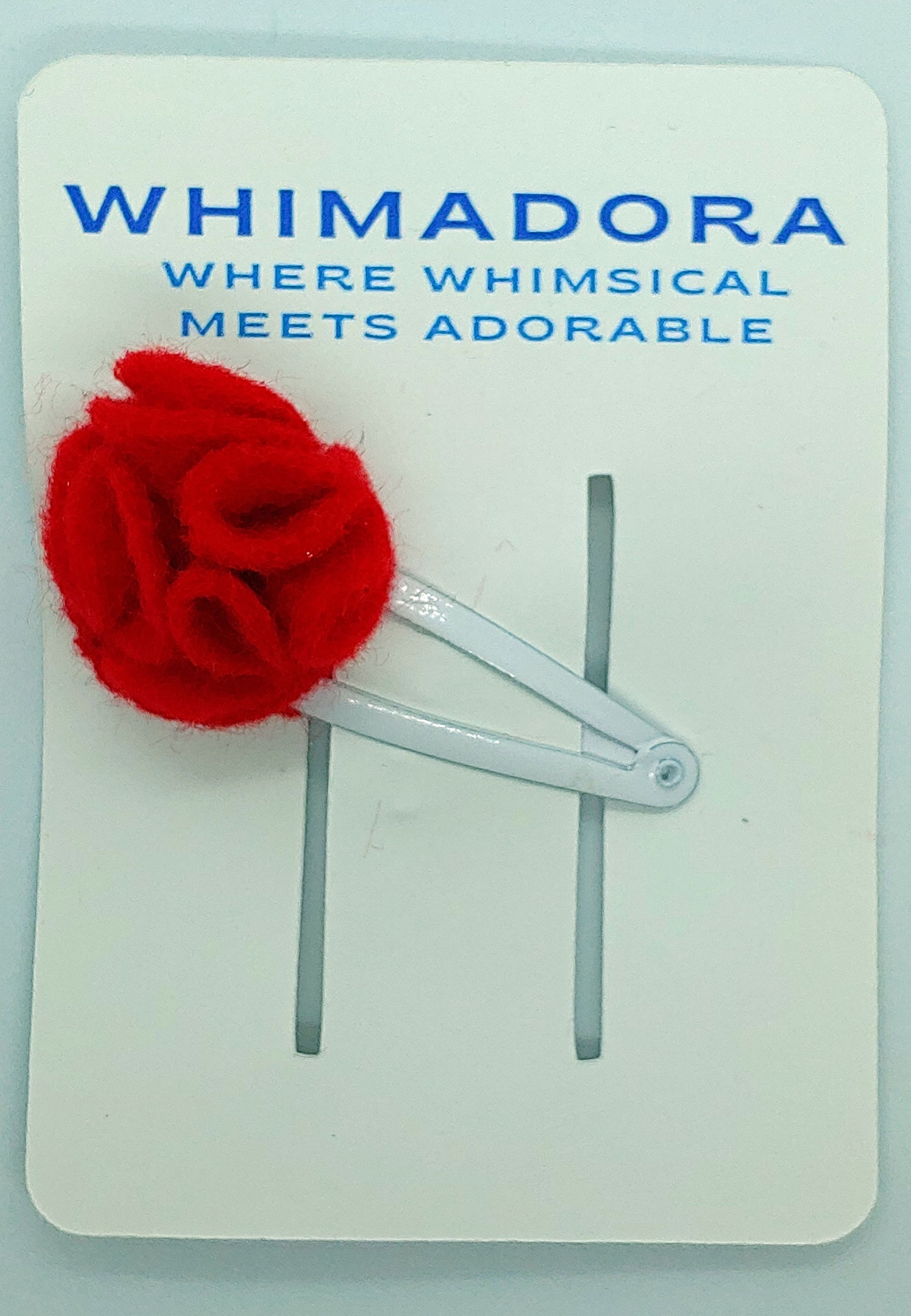 Handmade red flower felt hair clip with a secure snap clip. A charming and vibrant floral accessory, perfect for adding a pop of color to any hairstyle.