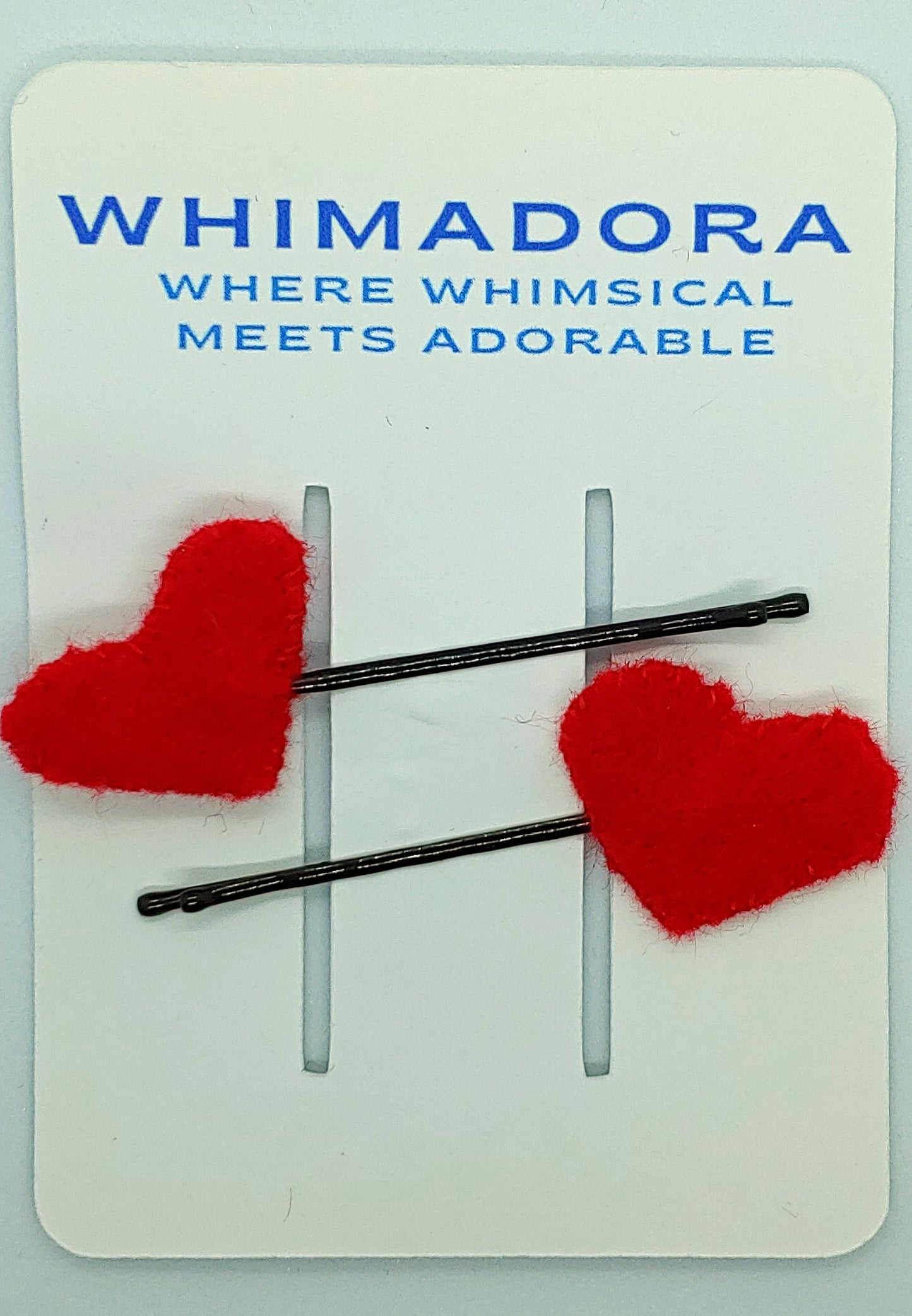 Set of two red heart felt hair clips on bobby pins. A cute and stylish accessory, perfect for Valentine's Day, gifts, or adding a pop of color.
