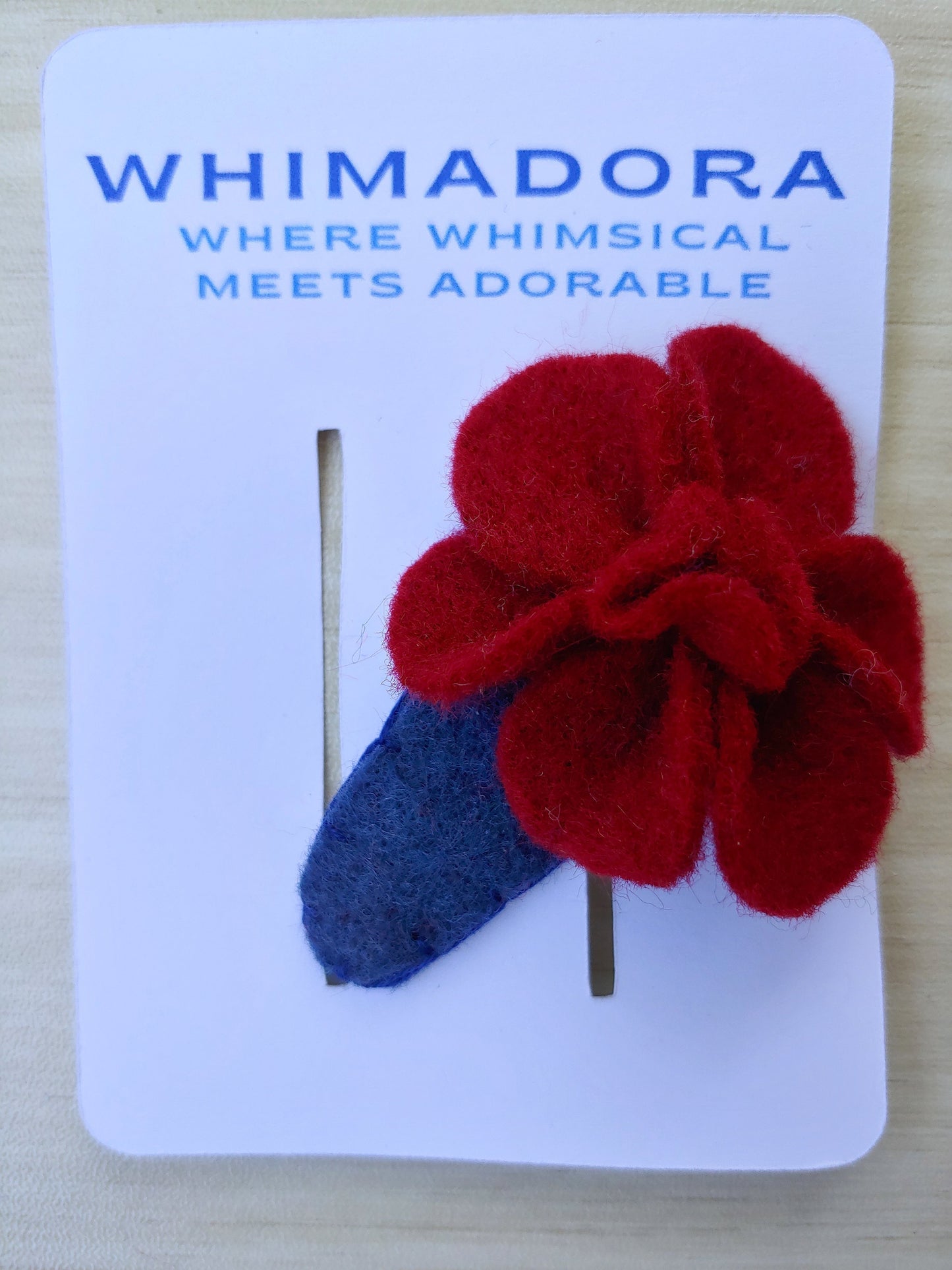 Handmade burgundy felt flower hair clip on a country blue snap clip. A stylish, elegant accessory for weddings, special occasions, or daily wear.