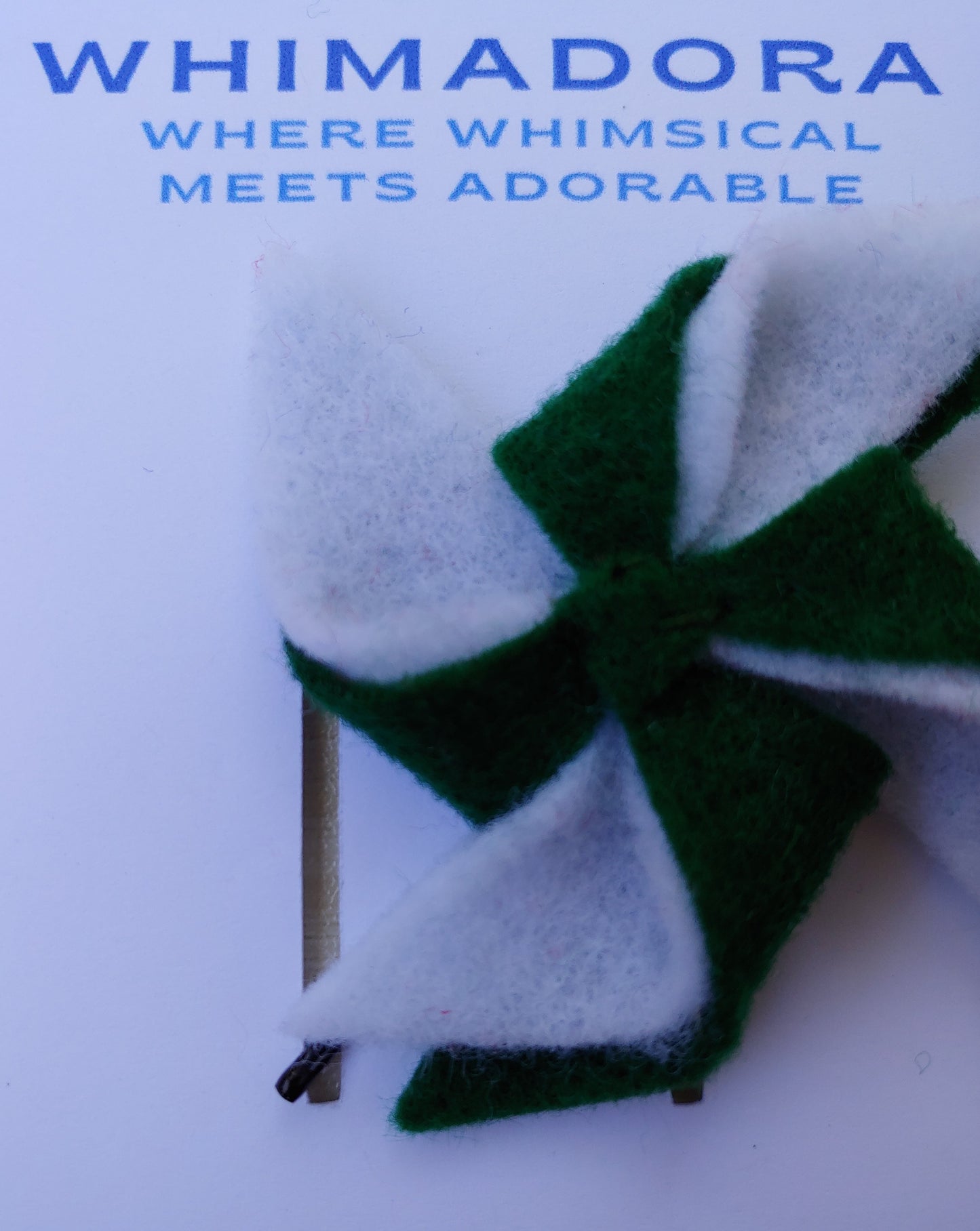 Handcrafted Green and White Pinwheel Felt Hair Clip with a secure bobby pin. A fun and stylish hair accessory, perfect for school spirit & everyday looks.