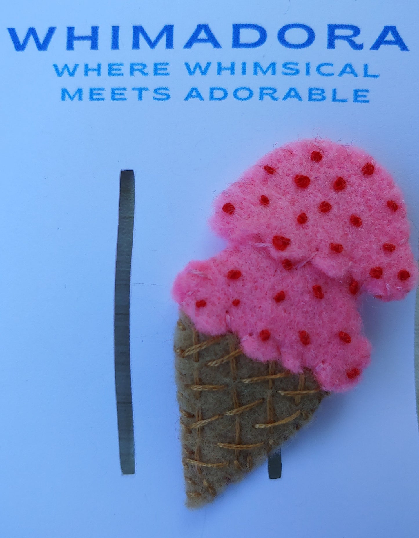 Handcrafted Pink Ice Cream Cone Felt Hair Clip featuring a tan cone, pink scoop, and red sprinkles on a secure snap clip - next to ruler. A fun summer accessory.