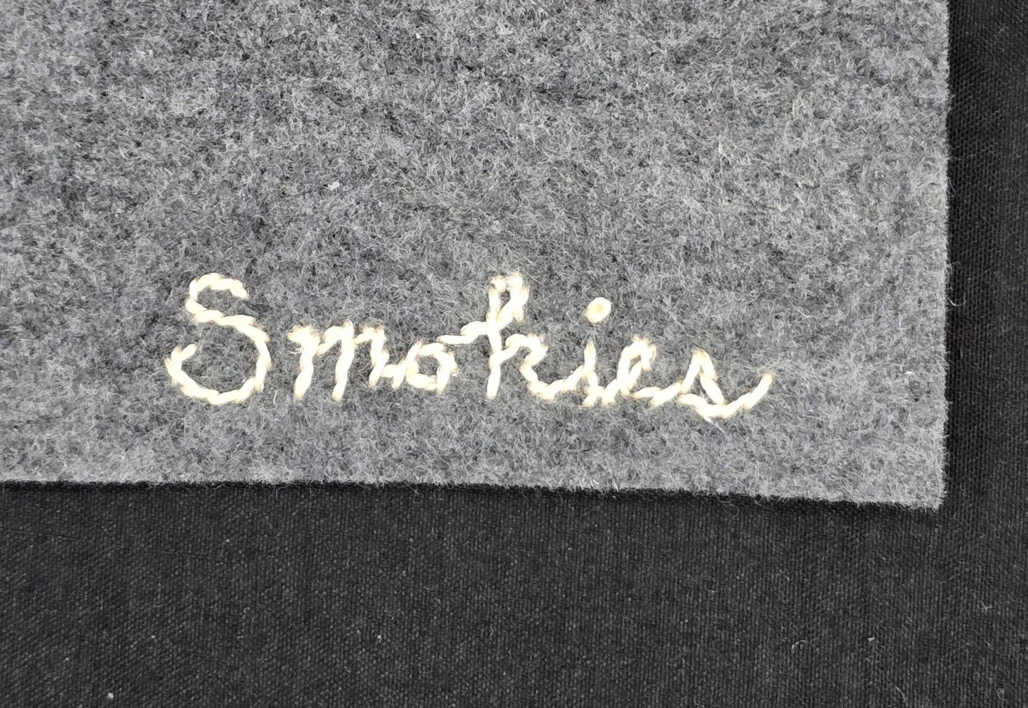 "Smokies" text in light color on grey felt.