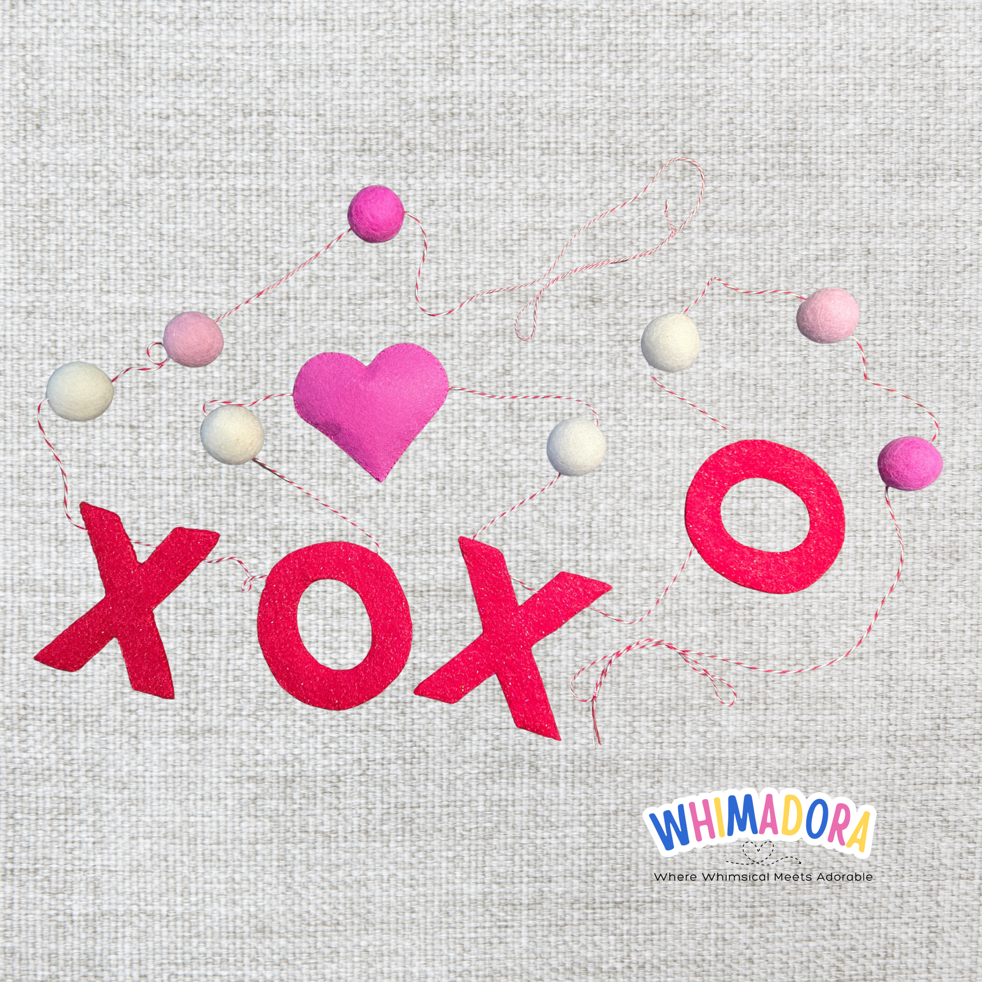 Decorative design with 'XOXO' and colorful hearts on a textured background, featuring the Whimadora brand.