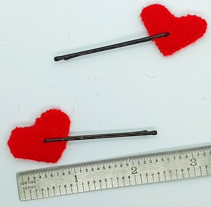 Add a touch of love to any hairstyle with these red heart hair clips